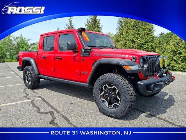 2020 Jeep Gladiator Rubicon 4x4 in Firecracker Red Clearcoat — front three-quarter view