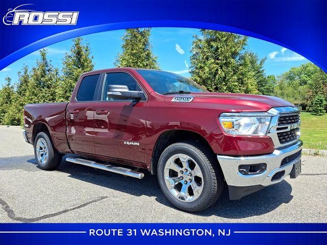 2022 RAM 1500 Big Horn 4x4 Quad Cab 6'4" Box in Delmonico Red Pearlcoat — front three-quarter view