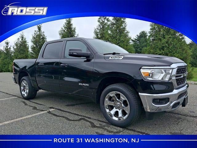 2023 RAM 1500 Big Horn 4x4 Crew Cab 5'7" Box in Diamond Black Crystal Pearlcoat — front three-quarter view
