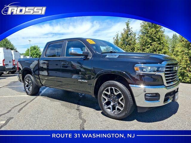 2026 RAM 1500 Laramie 4x4 Crew Cab 5'7" Box in Diamond Black Crystal Pearlcoat — front three-quarter view