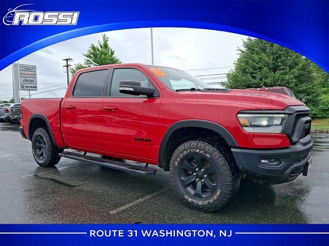 2022 RAM 1500 Rebel 4x4 Crew Cab 5'7" Box in Flame Red Clearcoat — front three-quarter view