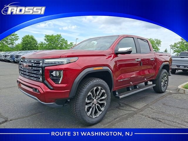 2026 GMC Canyon Denali in Volcanic Red Tintcoat — front three-quarter view