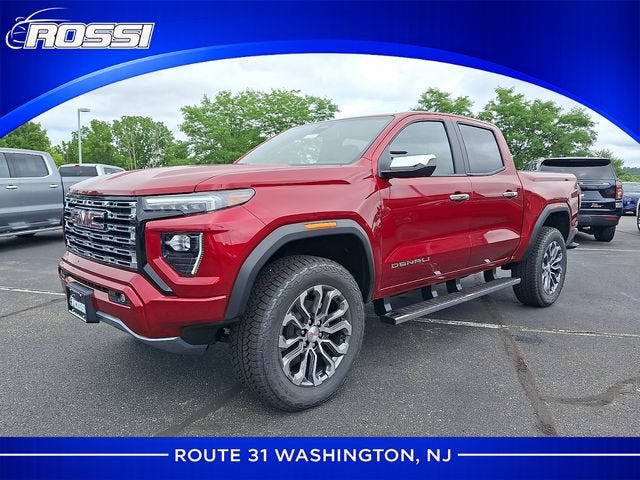 2026 GMC Canyon Denali in Volcanic Red Tintcoat — front three-quarter view